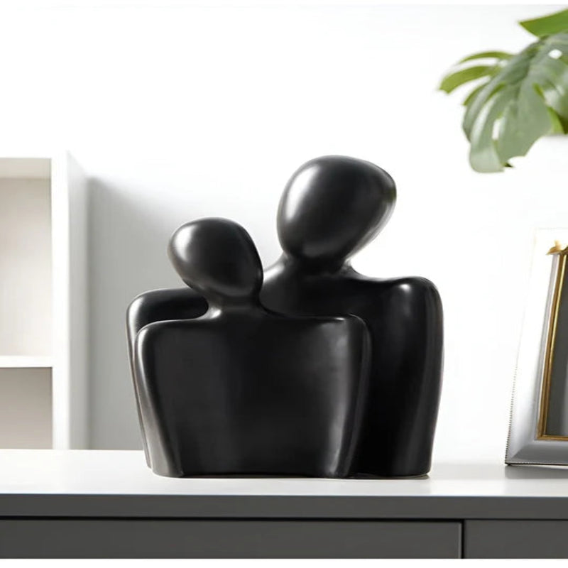 Moderne skulptur, der symboliserer bånd og ømhed